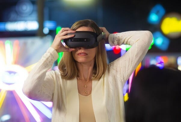 Woman wearing ThinkReality VRX VR headset