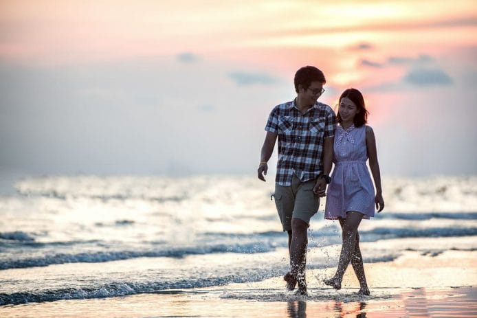how to Prioritizing Self-Care in Relationships Practice Gratitude - couple walking by the beach during sunset
